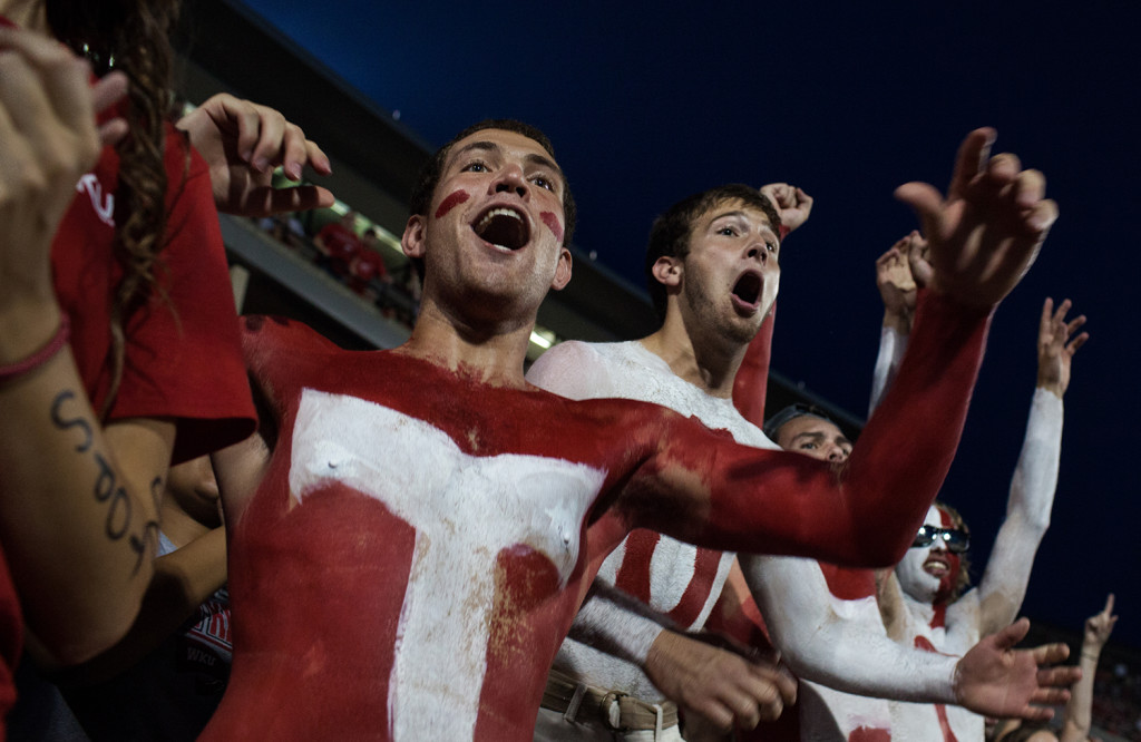 Fully painted, Russell Shanahan, left, and Alec Broughon cheer on the WKU football team during the season opener against Louisiana Tech on Thursday, September 10, 2015. The Hilltoppers defeated the Bulldogs 41-38. WESTON KENNEY