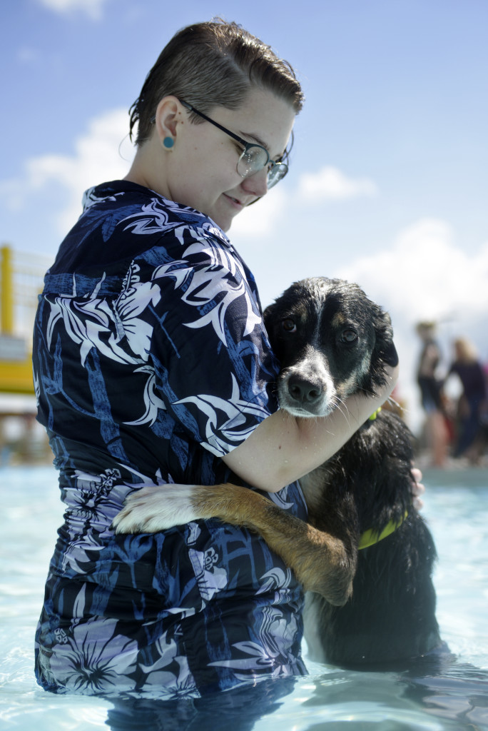Cass holds onto his owner Jeana Fowler during the Puppy Paddle event, Sept. 12. The dog had never been in the water before. KATIE ROBERTS