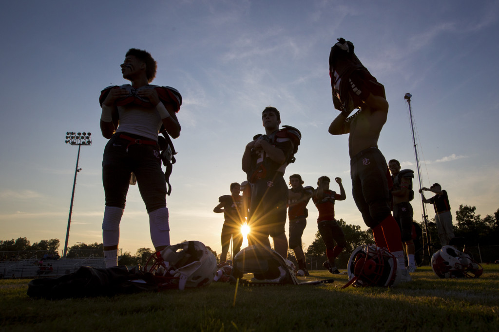 Members of the Daviess County High School football team put on their pads before their 49-21 loss to Owensboro High School on Sept. 18, 2015 at Daviess County's Reid Stadium in Owensboro, Ky. MIKE CLARKE