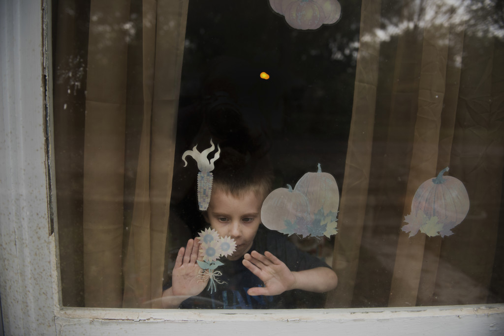 Ayden Jones, 5, sets up fall and halloween decorations at his grandmother's house in Bowling Green, Kentucky, on October 10, 2015. Jones loves decorating for halloween, and plans to dress up as Olaf from the movie 'Frozen' this year. His grandmother, Jennifer Johnson, loves to oblige him with everything from window stickers to giant inflatable witches and ghouls. LAUREN NOLAN
