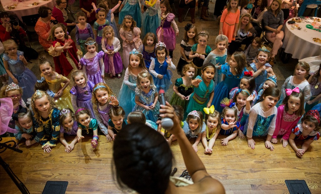 In excitement, little princesses crowded the stage as Ryelee Robinson, dressed up as Pocahontas, sang "Colors of the Wind," at Christ Episcopal Church on Sunday, February 21, 2016. This event was held by Bowling Green High School students to raise funds for the school's choral activities. |Weston kenney