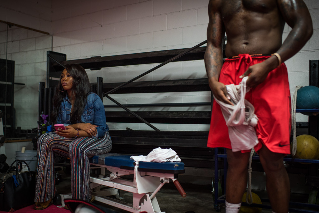 Jasmine Mayes, left, waits for her brother Rydell, right, to finish his training at the Boxing Resource Center in Nashville, Tennessee on March 30. She has witnessed his transformation and 80 pound weight loss over the last year as he has made boxing his priority and begins the transition to the professional level. The next fights throughout this year will determine his path as he attempts to drop more weight and be able to fight in the 175lb weight class.
