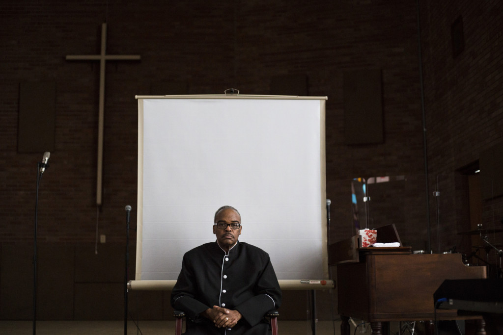 Flint, Michigan - March 3, 2016: Pastor Alfred Harris sits on the stage of his church, Saints of God Church, in Flint, Mich., on Thursday, March 3, 2016. Harris is an active member of the Concerned Pastors for Social Action, a group that has been active in advocating for Flint residents amidst the city's ongoing water crisis.