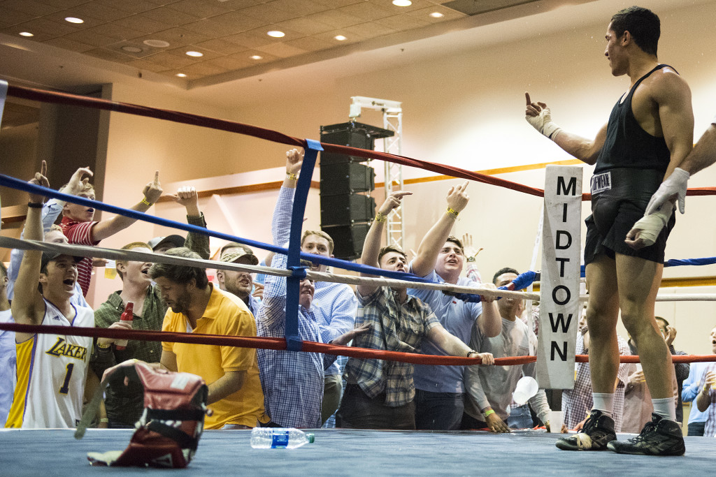 Members of Sigma Chi yell and flip off Miguel Barzel after his fight in the 165 weight class at the Sigma Chi Battle of the fight night competition at the Salon Conference center March 18, 2016 in Bowling Green, Kentucky. "Its fun to mess with them" said Barzel after the fight.