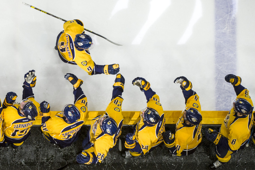 Nashville Predators center Filip Forsberg (9) is congratulated by teammates after scoring a goal against the Colorado Avalanche during an NHL game at Bridgestone Arena in Nashville, Tennessee, on Tuesday, April 5, 2016. The Predators beat the Avalanche 4-3, disqualifying Colorado from the playoffs. Nick Wagner/CSM Images