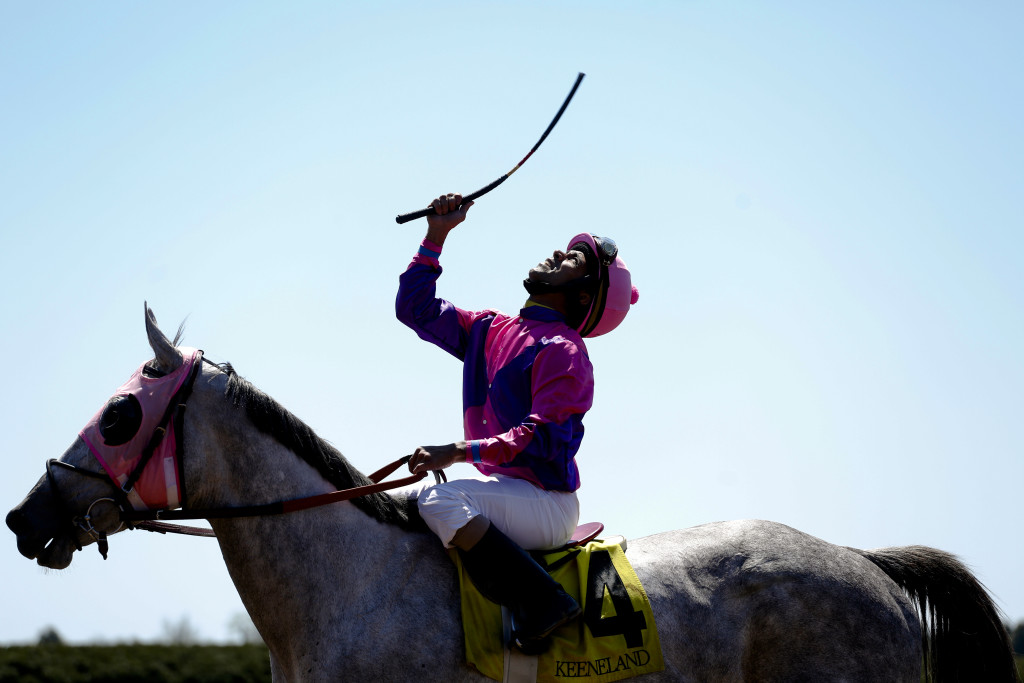 Shaun Bridgmohan celebrates his 1st place victory riding four-year-old Miss Pink Diva during the Maiden Special Weight horse race at Keeneland Racecourse on April 17, 2016. The win was a first for Miss Pink Diva, earning $36,000.